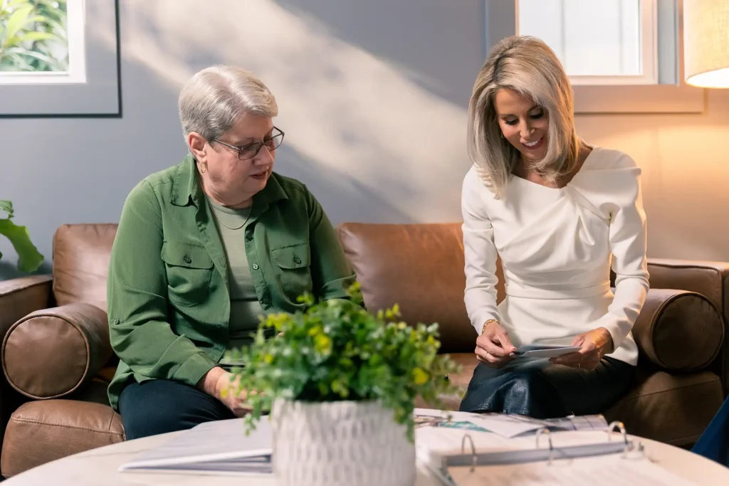 rebecca franklin harris seated at a couch with an elderly client