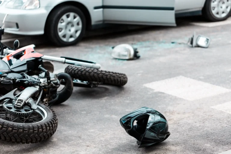 overturned motorcycle on the ground after an accident